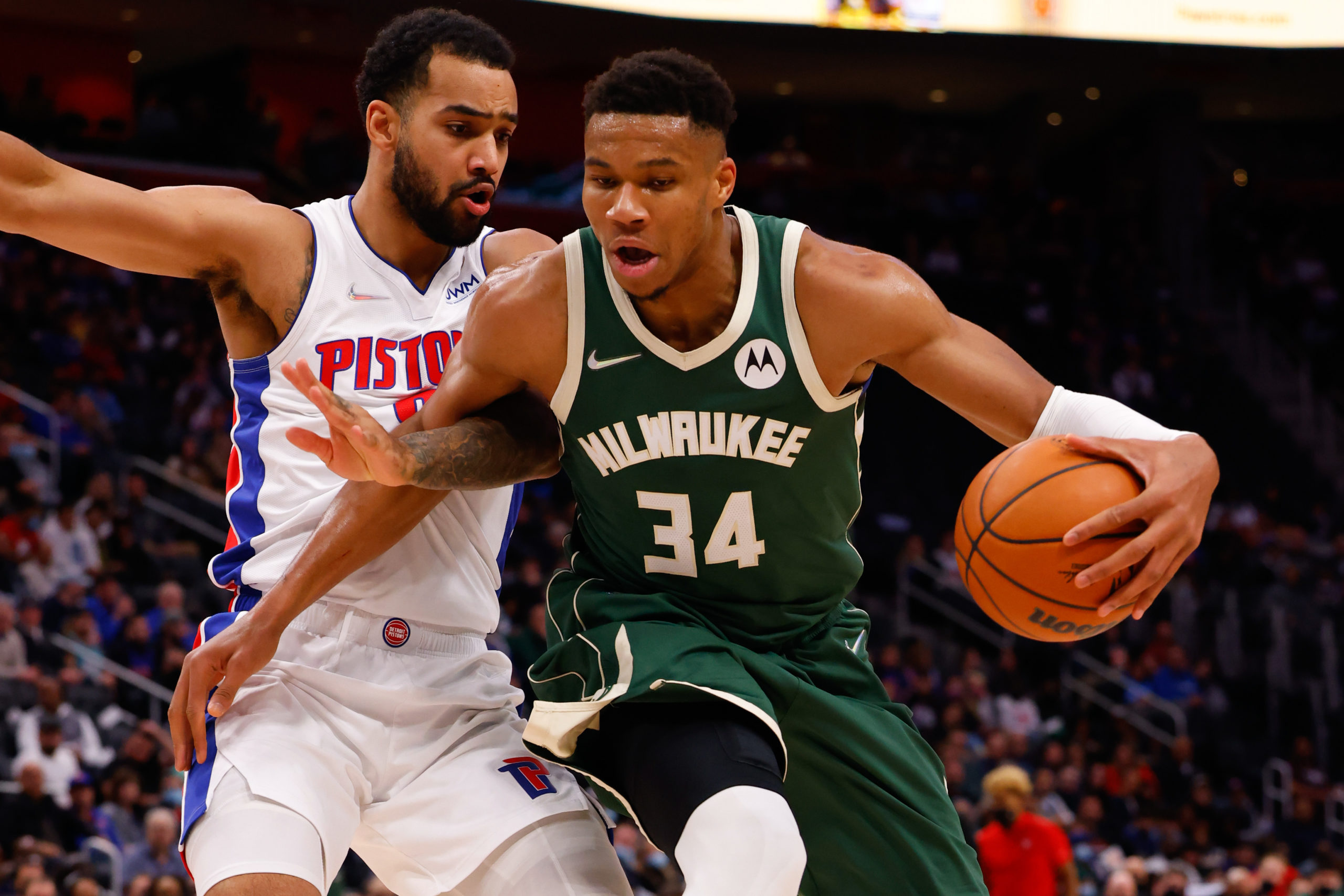 Milwaukee Bucks forward Giannis Antetokounmpo (34) is defended by Detroit Pistons forward Trey Lyles (8) in the first half at Little Caesars Arena