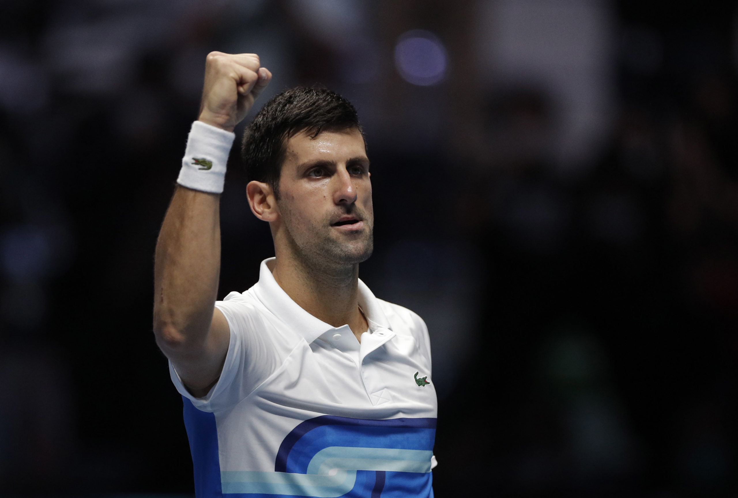 Serbia’s Novak Djokovic celebrates winning his group stage match against Russia’s Andrey 