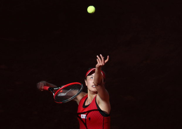 China's Peng Shuai in action against Spain's Garbine Muguruza during their round of 64 match