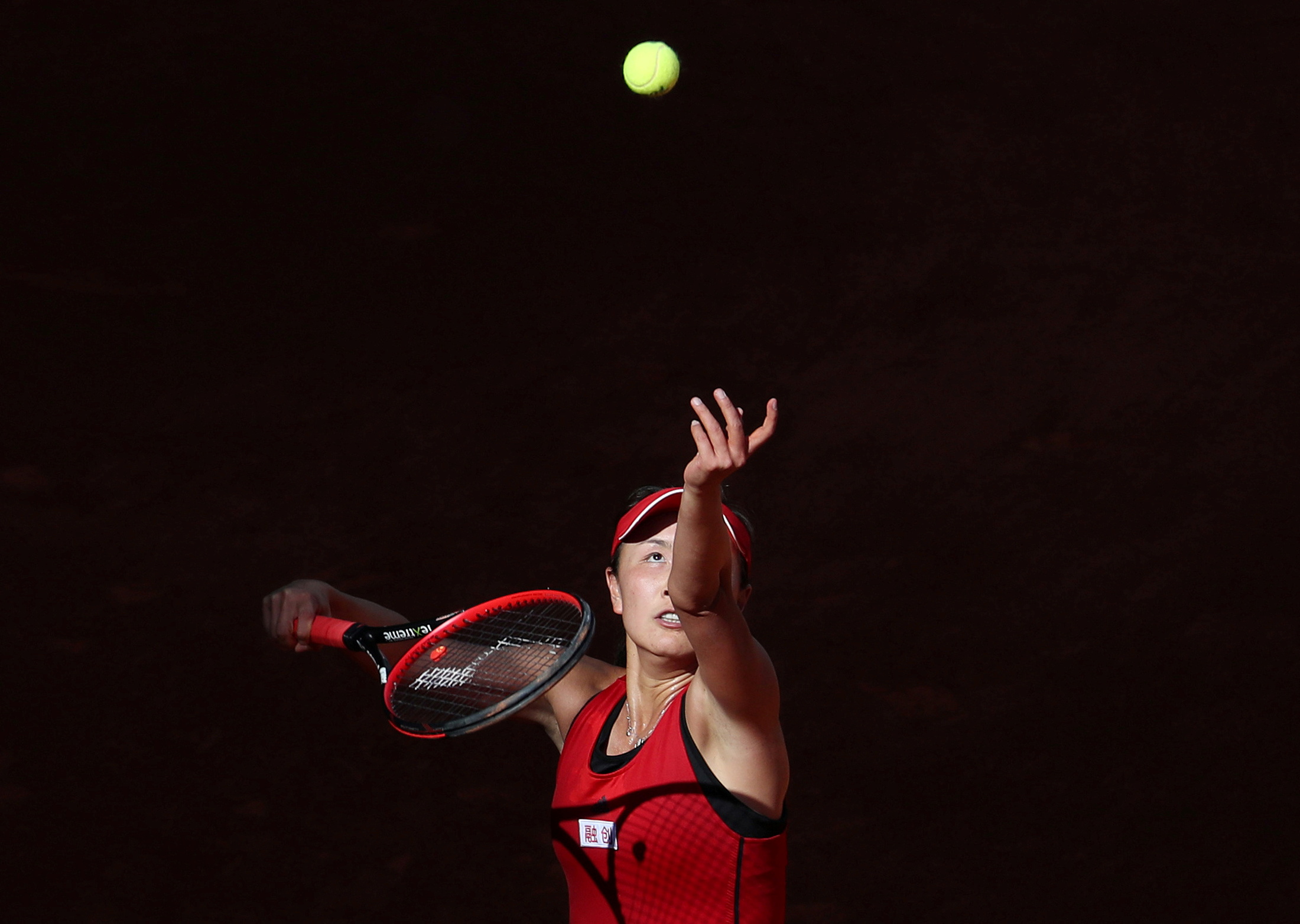 China's Peng Shuai in action against Spain's Garbine Muguruza during their round of 64 match   