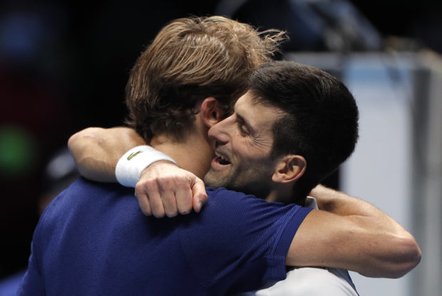 Tennis - ATP Finals - Pala Alpitour, Turin, Italy - November 20, 2021  Serbia's Novak Djokovic hugs Germany's Alexander Zverev after losing their semi final match REUTERS/Guglielmo Mangiapane