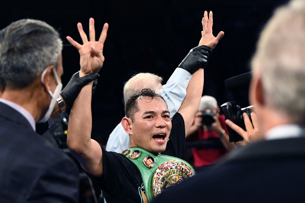 Filipino boxer Nonito Donaire (C) celebrates after knocking out French boxer Nordine Oubaali after winning the Bantamweight World Championship boxing match at Dignity Health Sports Park on May 29, 2021 in Carson, California.