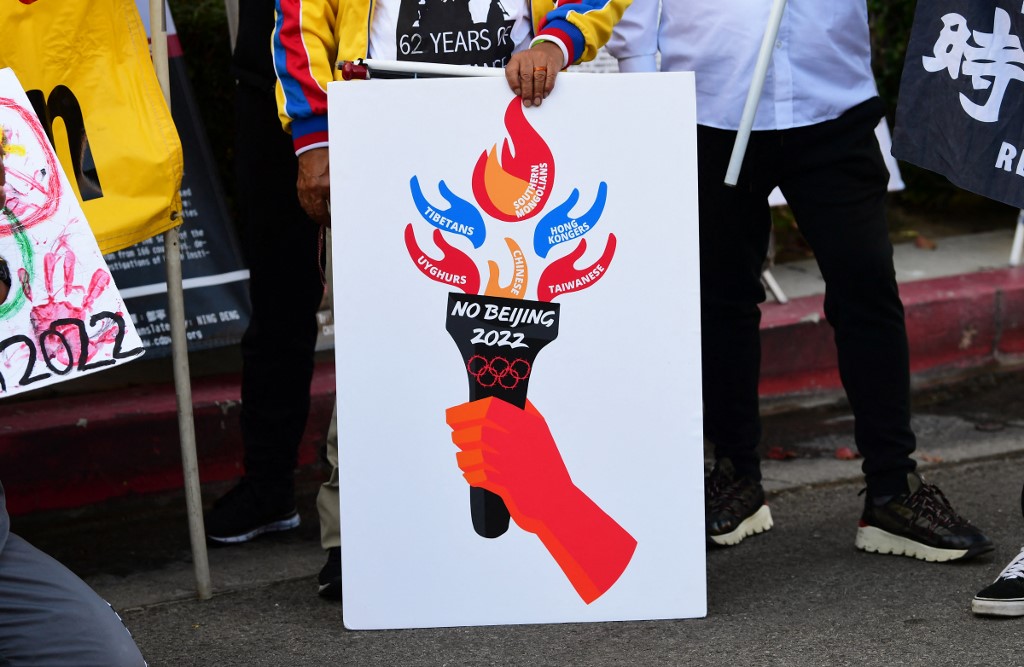 (FILES) In this file photo taken on November 3, 2021 activists rally in front of the Chinese Consulate in Los Angeles, California, calling for a boycott of the 2022 Beijing Winter Olympics due to concerns over China's human rights record. -