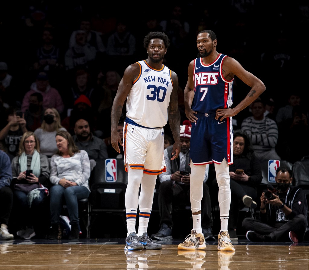 Julius Randle #30 of New York Knicks and Kevin Durant #7 of the Brooklyn Nets interact during a regular season matchup at Barclays Center on November 30, 2021 in the Brooklyn borough of New York City. NOTE TO USER: 
