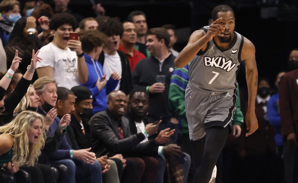Kevin Durant #7 of the Brooklyn Nets reacts after scoring a three-point shot against the Dallas Mavericks in the second half at American Airlines Center on November 7, 2021 in D
