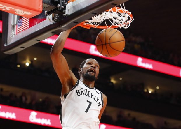 Kevin Durant #7 of the Brooklyn Nets dunks during the first half against the Atlanta Hawks at State Farm Arena on December 10, 2021 in Atlanta, Georgia.
