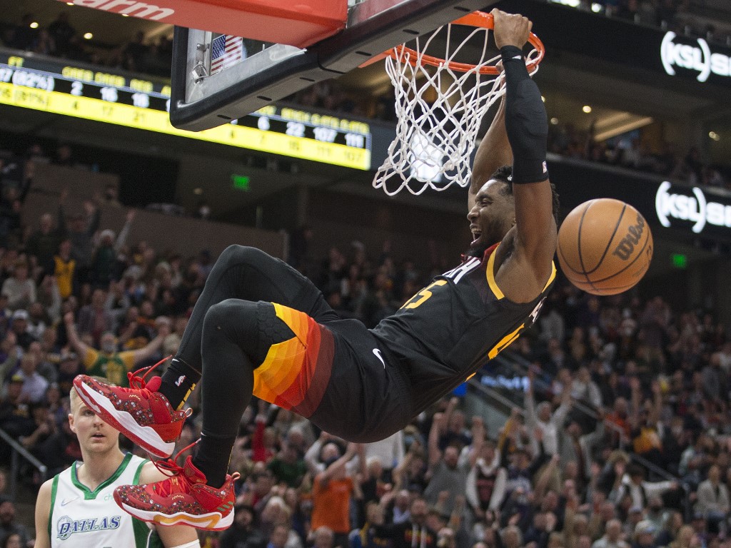  Donovan Mitchell #45 of the Utah Jazz dunks the ball against the Dallas Mavericks during the first half of their game at the Vivint Smart Home Arena on December 25, 2021 in Salt Lake City, Utah. 