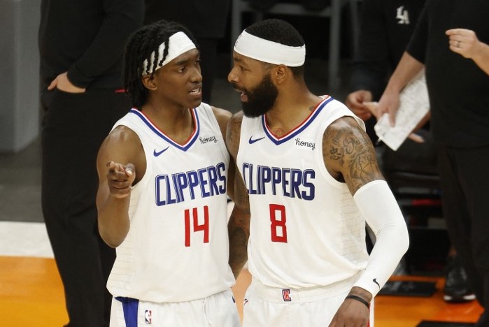 PHOENIX, ARIZONA - JUNE 28: Terance Mann #14 and Marcus Morris Sr. #8 of the LA Clippers talk during the first half in Game Five of the Western Conference Finals against the Phoenix Sunsat Phoenix Suns Arena on June 28, 2021 in Phoenix, Arizona. NOTE TO USER: User expressly acknowledges and agrees that, by downloading and or using this photograph, User is consenting to the terms and conditions of the Getty Images License Agreement.   Christian Petersen/Getty Images/AFP (Photo by Christian Petersen / GETTY IMAGES NORTH AMERICA / Getty Images via AFP)