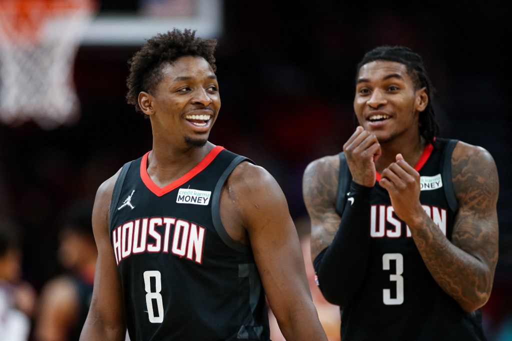 Jae'Sean Tate #8 of the Houston Rockets reacts alongside Kevin Porter Jr. #3 during the second half against the Oklahoma City Thunder at Toyota Center on November 29, 2021 in Houston, Texas.