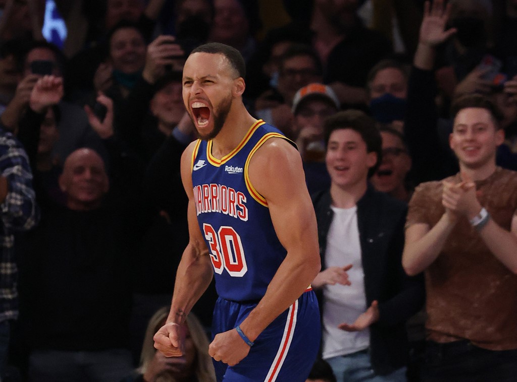 Stephen Curry #30 of the Golden State Warriors celebrates after making a three point basket to break Ray Allens record for the most all-time against the New York Knicks during their game at Madison Square Garden on December 14, 2021 in New York City. 