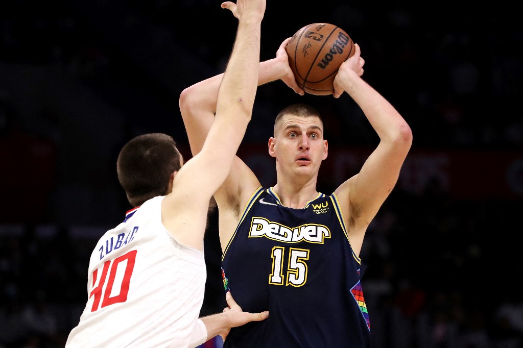 Nikola Jokic #15 of the Denver Nuggets looks to pass the ball against Ivica Zubac #40 of the Los Angeles Clippers during the third quarter at Crypto.com Arena on December 26, 2021 in Los Angeles, California. 