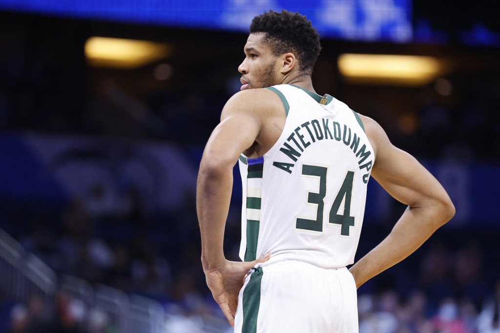 Giannis Antetokounmpo #34 of the Milwaukee Bucks looks on against the Orlando Magic during the first half at Amway Center on December 30, 2021 in Orlando, Florida. 
