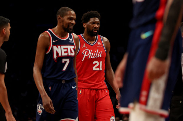 Joel Embiid #21 of the Philadelphia 76ers prepares to shoot a free throw as Kevin Durant #7 of the Brooklyn Nets looks on during the fourth quarter at Barclays Center on December 30, 2021 in New York City. NOTE TO USER: User expressly acknowledges and agrees that, by downloading and or using