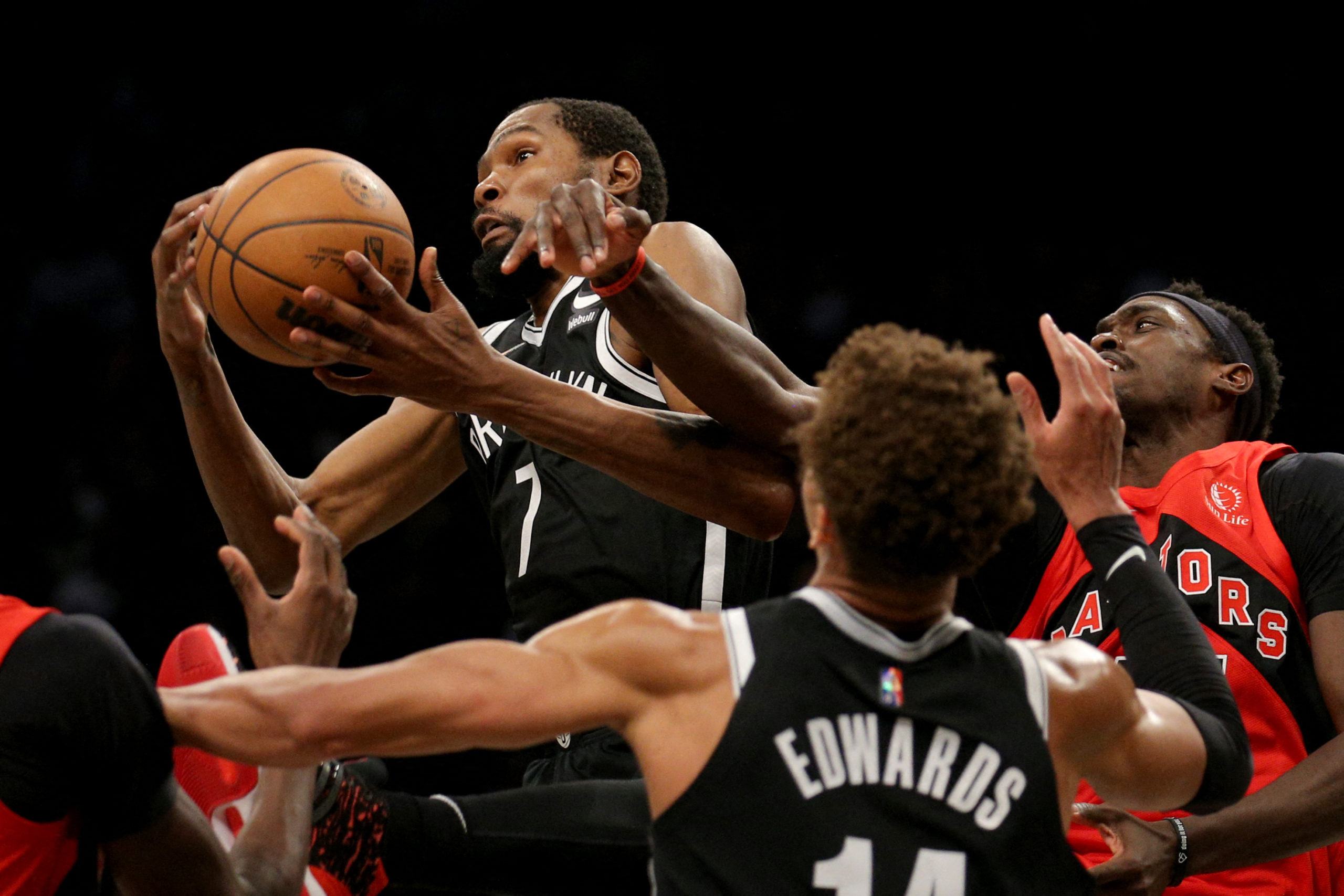 Brooklyn Nets forward Kevin Durant (7) grabs a rebound against Toronto Raptors forward Pascal Siakam (43) during the second quarter at Barclays Center. 