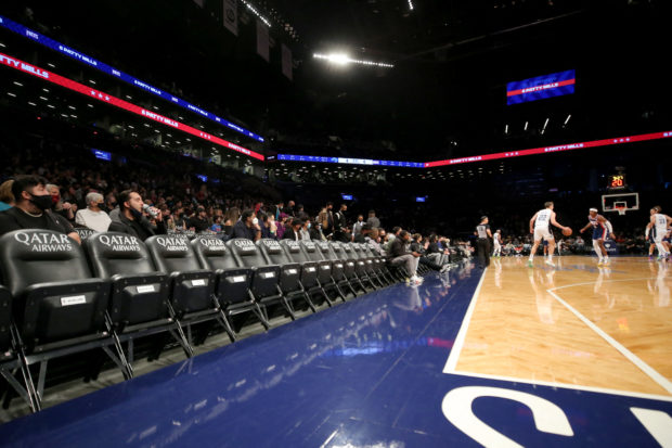 Dec 18, 2021; Brooklyn, New York, USA; General view of mostly empty courtside seats as Orlando Magic forward Franz Wagner (22) controls the ball against the Brooklyn Nets during the first quarter at Barclays Center. Mandatory Credit: Brad Penner-USA TODAY Sports