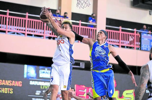 Rafi Reavis (right), here losing the rebound to TNT’s Poy Erram in the PH Cup Finals, won’t be able to finish the PBA season if he doesn’t get vaccinated. 