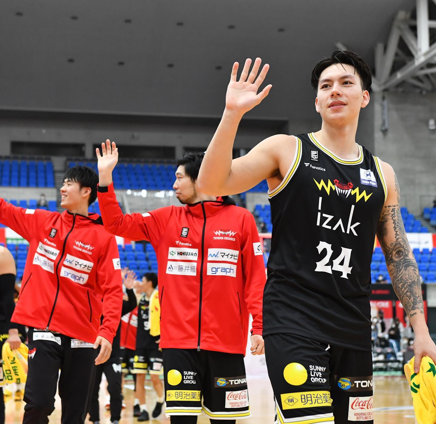 FILE - Dwight Ramos and his Toyama Grouses teammates.