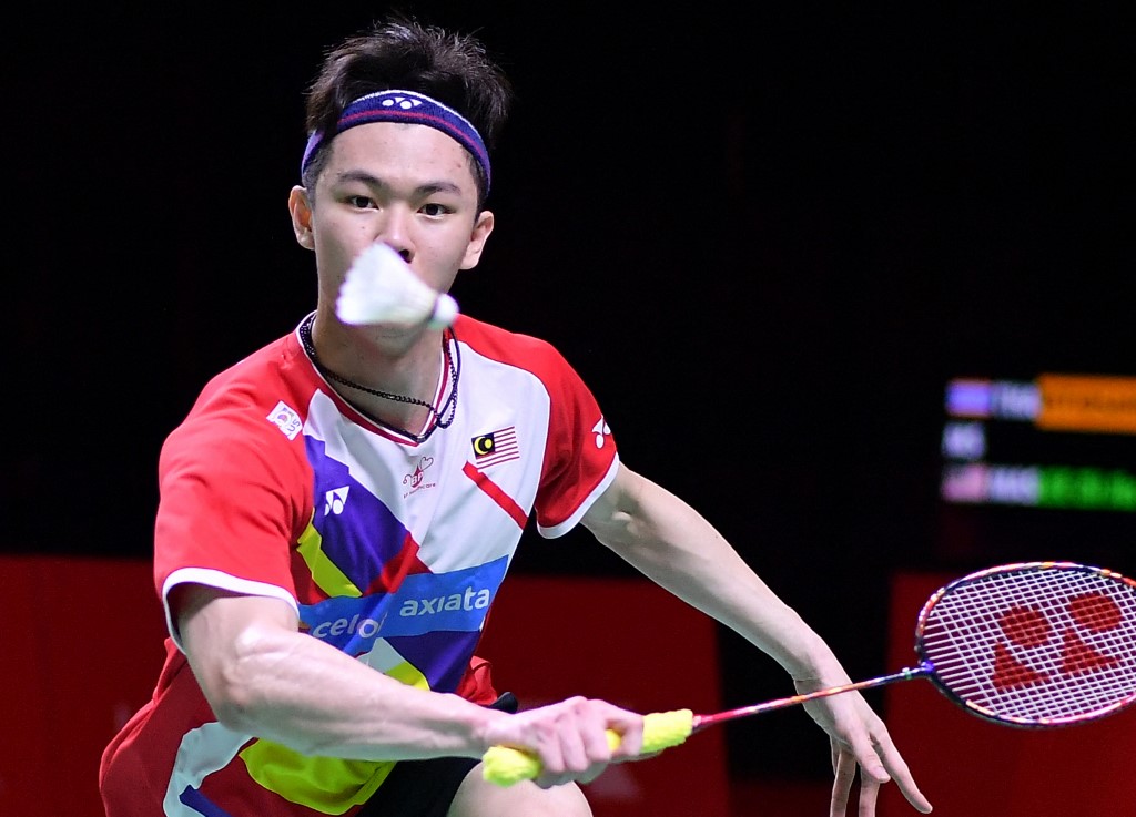 This handout photo taken and released on December 4, 2021 by the Badminton Association of Indonesia shows Malaysias Lee Zii Jia hitting a return against Thailands Kunlavut Vitidsarn during their mens singles semi-final badminton match at the BWF World Tour Finals in Nusa Dua on the resort island of Bali. 
