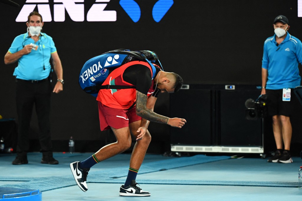Australia's Nick Kyrgios walks off the court after losing to Russia's Daniil Medvedev in their men's singles match on day four of the Australian Open tennis tournament in Melbourne on January 20, 2022. 
