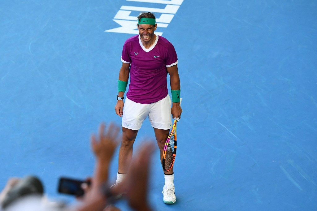 Spain's Rafael Nadal celebrates winning the men's singles quarter-final match against Canada's Denis Shapovalov on day nine of the Australian Open tennis tournament in Melbourne on January 25, 2022. 