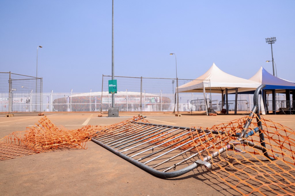 This picture taken on January 25, 2022 at the entrance of Olembe stadium in Yaounde shows barriers on the ground at the scene of the stampede. 