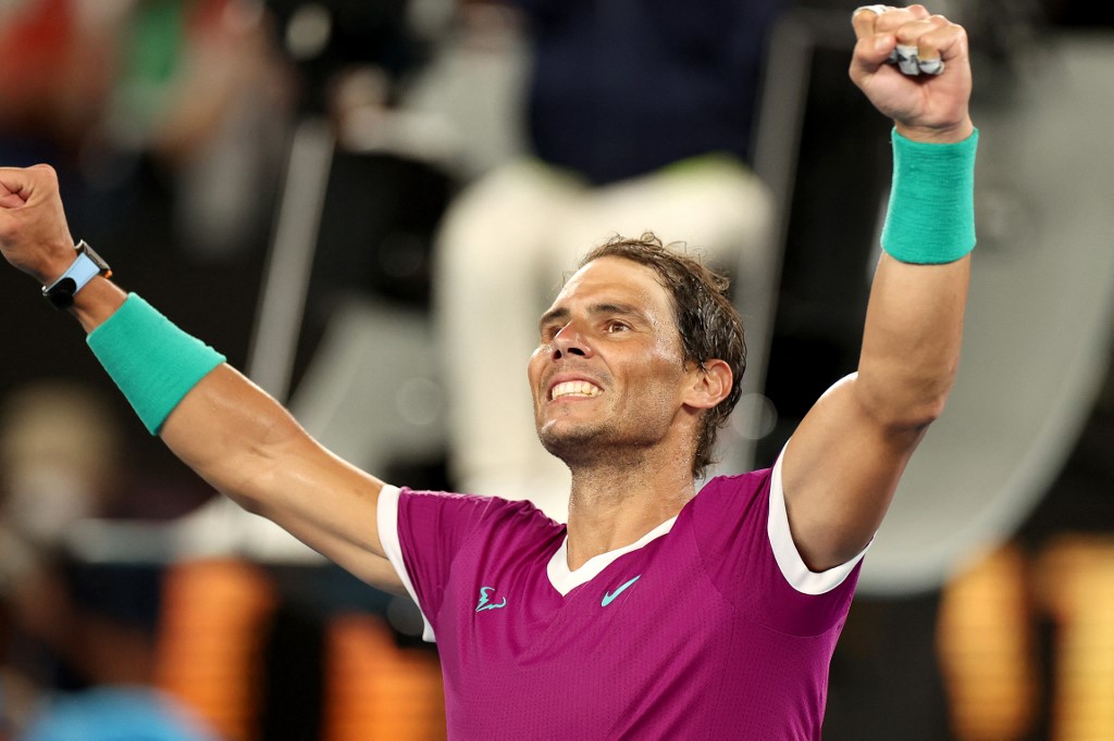 Spain's Rafael Nadal celebrates after winning the men's singles semi-final match against Italy's Matteo Berrettini on day twelve of the Australian Open tennis tournament in Melbourne on January 28, 2022. 