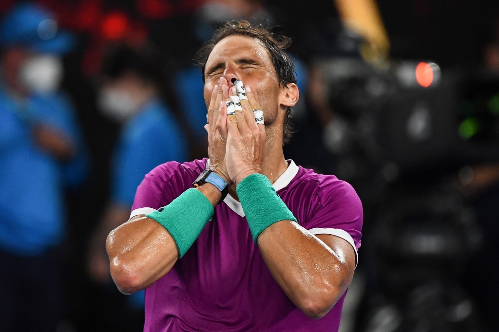 Spain's Rafael Nadal celebrates after victory against Italy's Matteo Berrettini during their men's singles semi-final match on day twelve of the Australian Open tennis tournament in Melbourne on January 28, 2022.