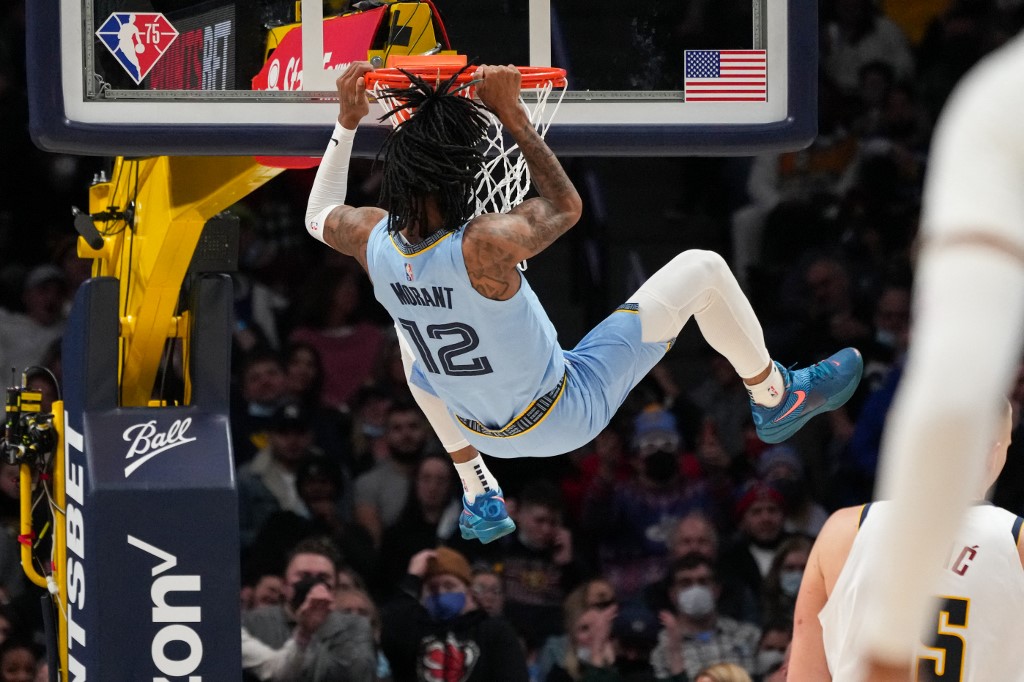 Ja Morant #12 of the Memphis Grizzlies dunks the ball against the Denver Nuggets at Ball Arena on January 21, 2022 in Denver, Colorado.