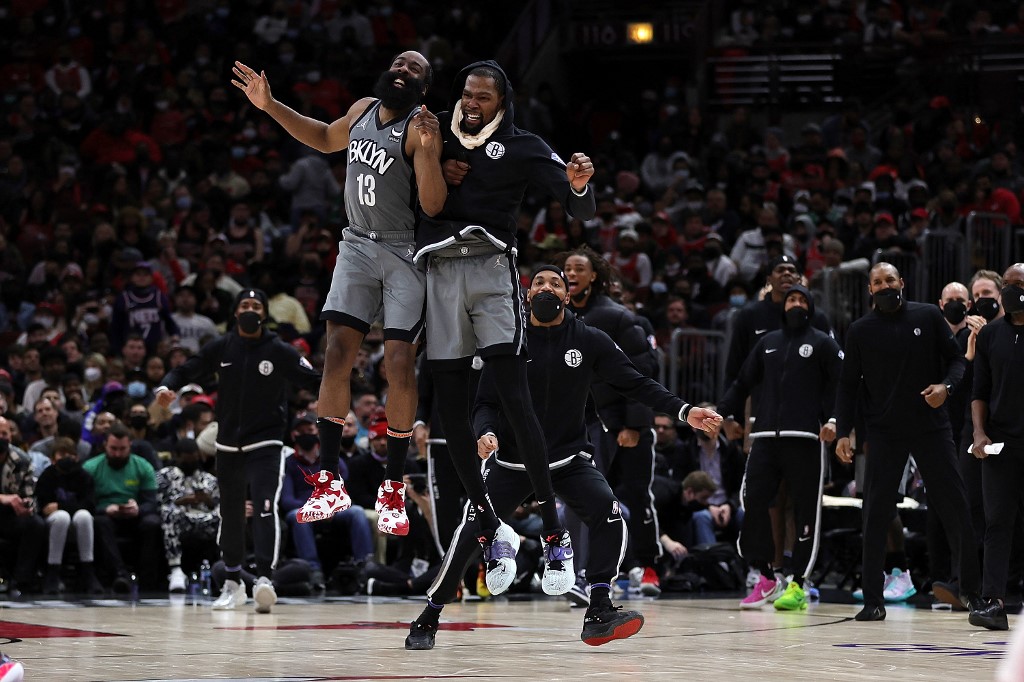 James Harden #13 and Kevin Durant #7 of the Brooklyn Nets celebrate after a score during the second half of a game against the Chicago Bulls at United Center on January 12, 2022 in Chicago, Illinois.