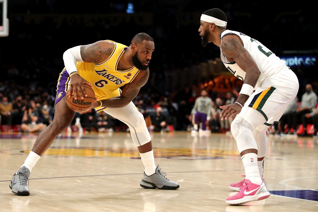 LeBron James #6 of the Los Angeles Lakers handles the ball against Royce O'Neale #23 of the Utah Jazz during the second quarter at Crypto.com Arena on January 17, 2022 in Los Angeles, California. 
