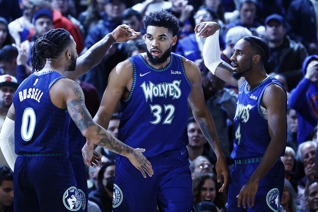 D'Angelo Russell #0, Karl-Anthony Towns #32, and Jaylen Nowell #4 of the Minnesota Timberwolves react during the second half against the New York Knicks at Madison Square Garden on January 18, 2022 in New York City.