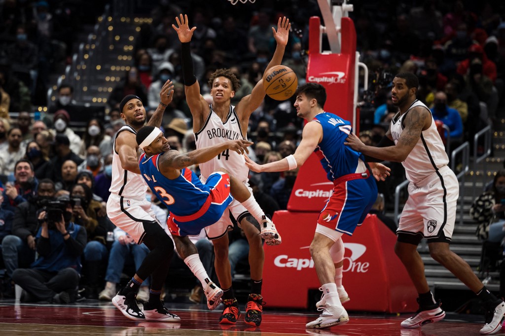 Bradley Beal #3 of the Washington Wizards falls backwards after being fouled by Kessler Edwards #14 of the Brooklyn Nets during the second half at Capital One Arena on January 19, 2022 in Washington, DC. 