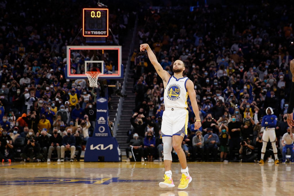 Stephen Curry #30 of the Golden State Warriors shoots the game-winning shot as time expires to defeat the Houston Rockets at Chase Center on January 21, 2022 in San Francisco, California. 