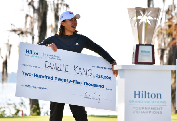 Danielle Kang of the United States reacts after receiving a check for winning the 2022 Hilton Grand Vacations Tournament of Champions at Lake Nona Golf & Country Club on January 23, 2022 in Orlando, Florida.   Julio Aguilar/Getty Images/AFP (Photo by Julio Aguilar / GETTY IMAGES NORTH AMERICA / Getty Images via AFP