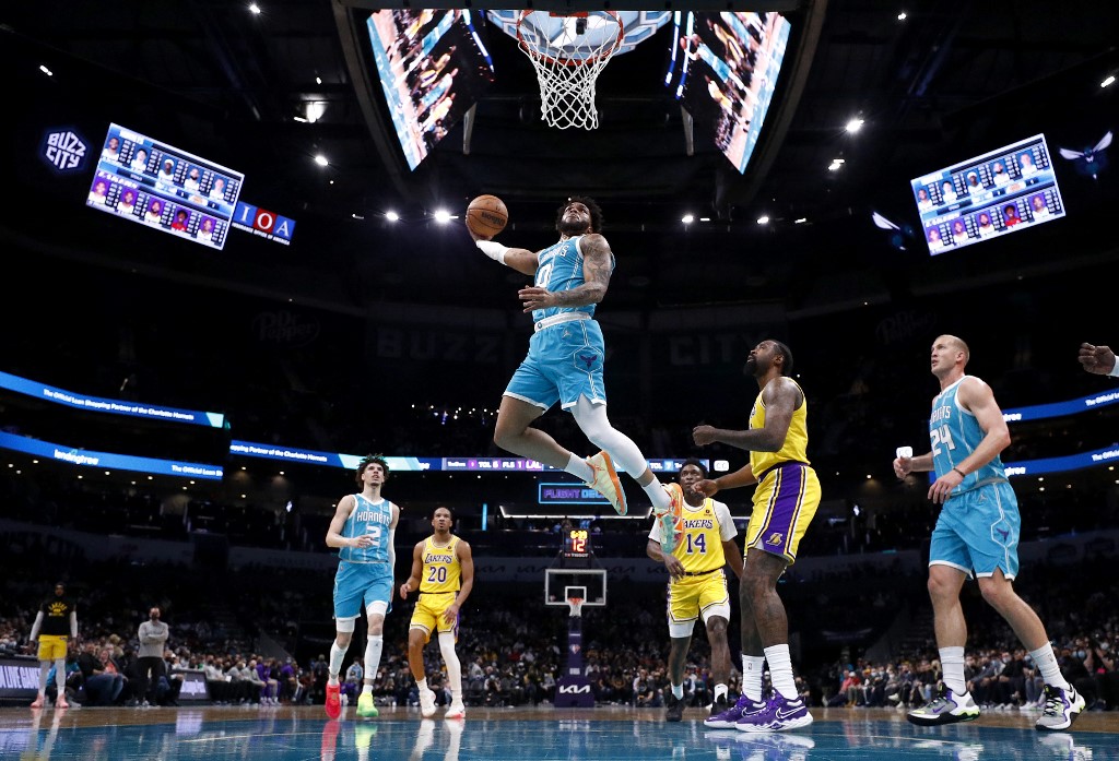 Miles Bridges #0 of the Charlotte Hornets dunks the ball during the first half of the game against the Los Angeles Lakers at Spectrum Center on January 28, 2022 in Charlotte, North Carolina. 