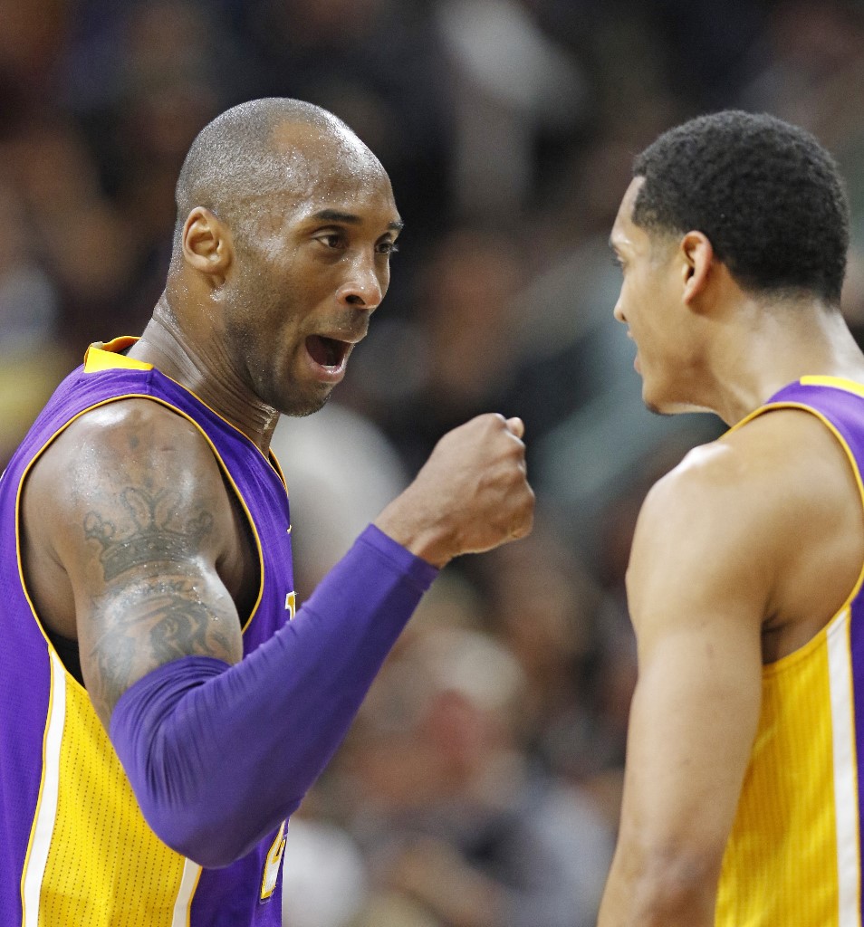  Kobe Bryant #24 of the Los Angeles Lakers celebrates with teammate Jordan Clarkson #6 of the Los Angeles Lakers after Bryant hit a three against the San Antonio Spurs at AT&T Center on February 6, 2016 in San Antonio, Texas.