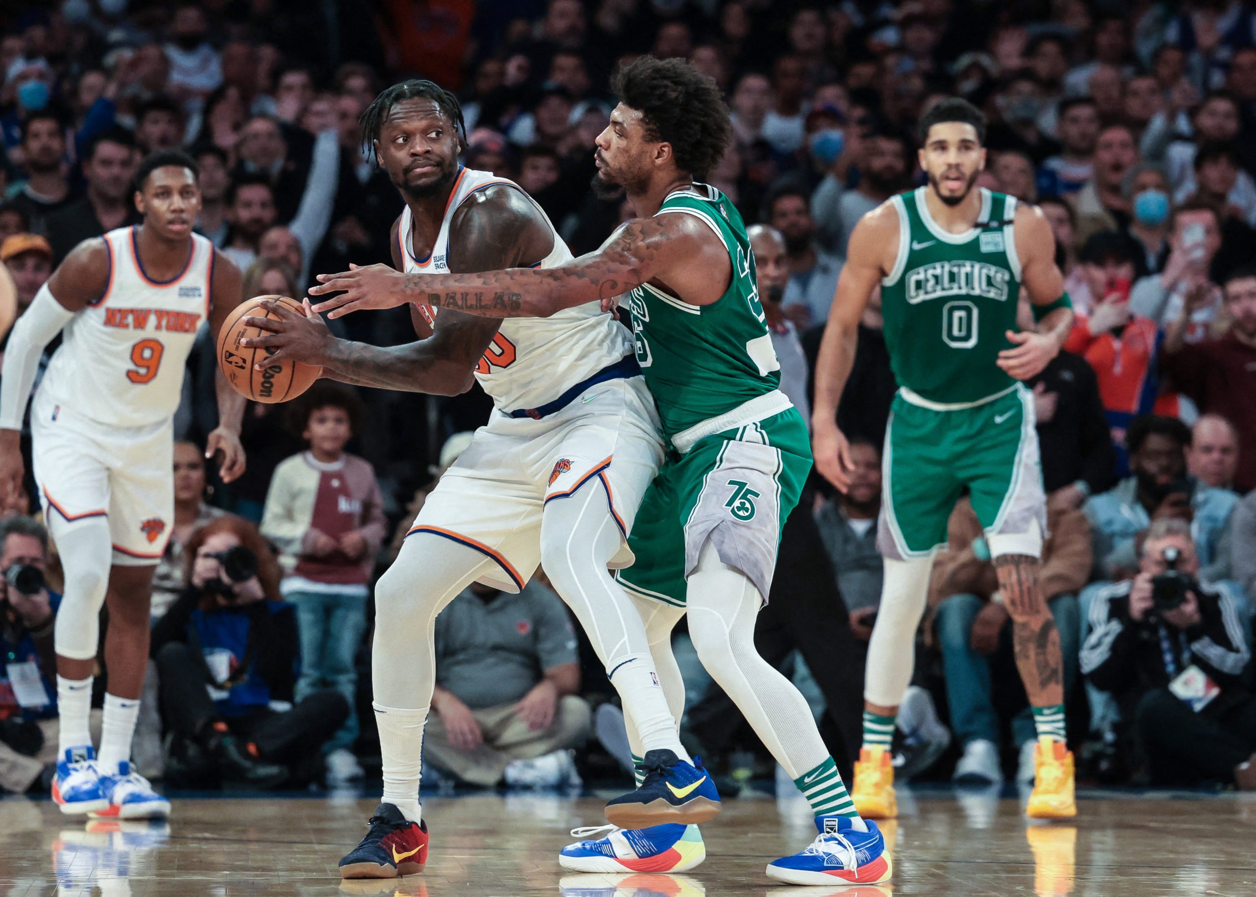 New York Knicks forward Julius Randle (30) is guarded by Boston Celtics guard Marcus Smart (36) during the second half at Madison Square Garden. 