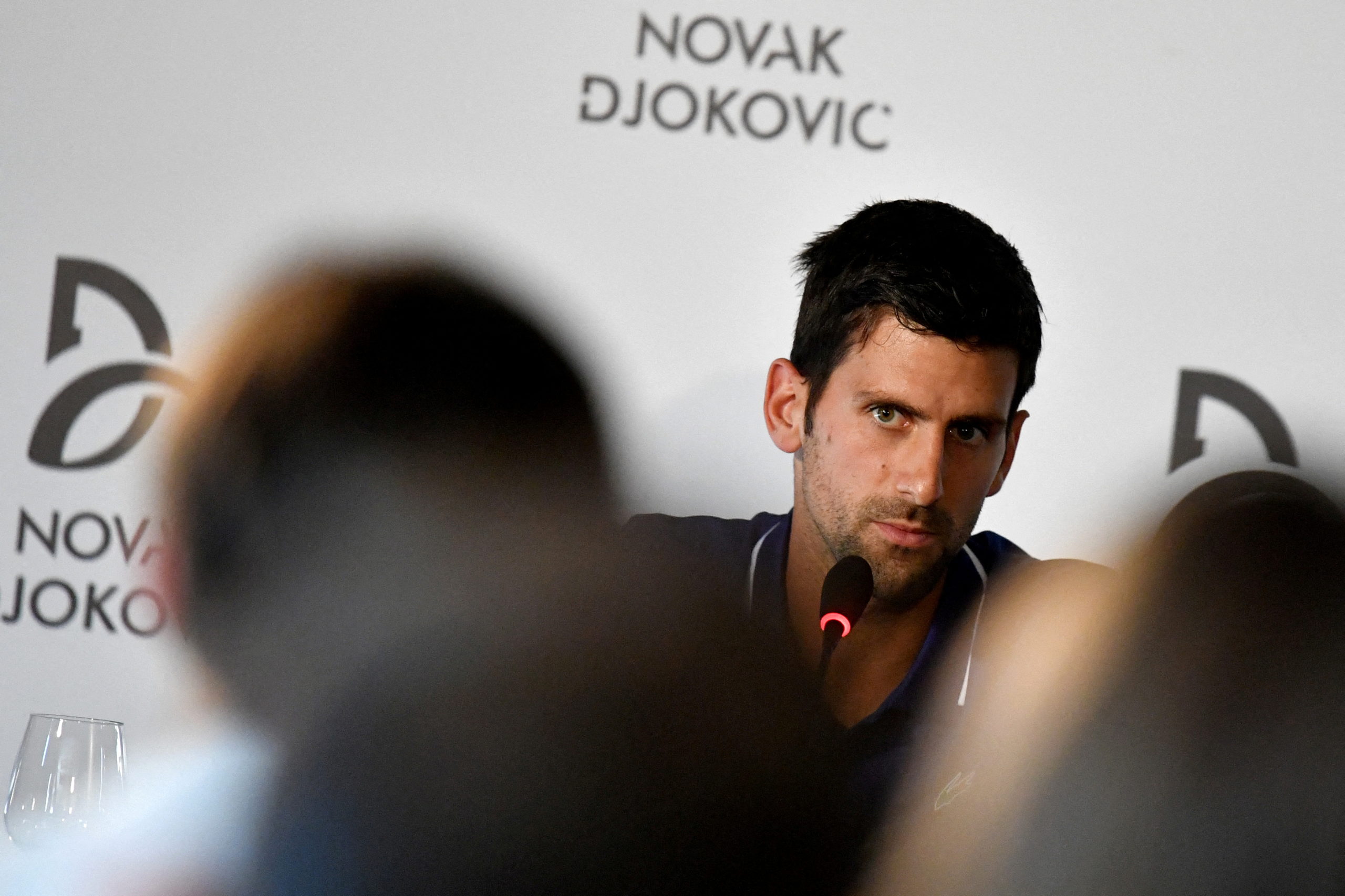 FILE PHOTO: FILE PHOTO: Former world No.1 tennis player Novak Djokovic speaks during a news conference in Belgrade, Serbia July 26, 2017. 