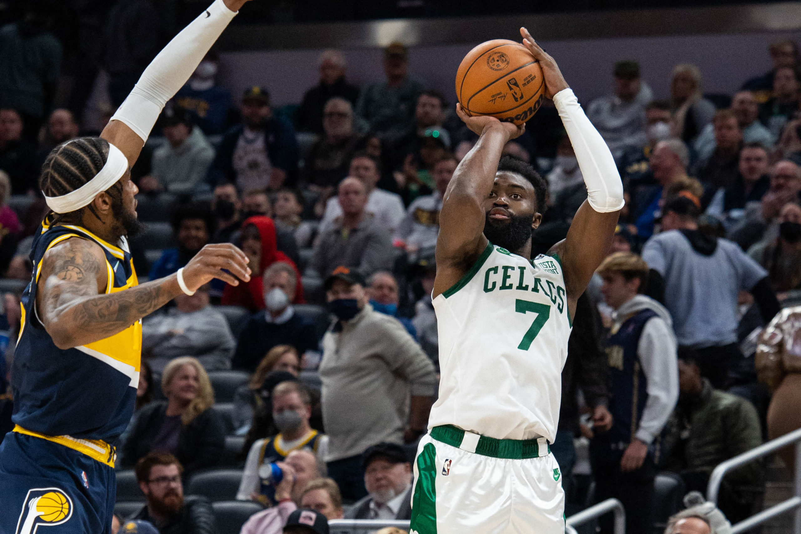 Boston Celtics guard Jaylen Brown (7) shoots the ball while Indiana Pacers forward Oshae Brissett (12) defends in the second half at Gainbridge Fieldhouse.
