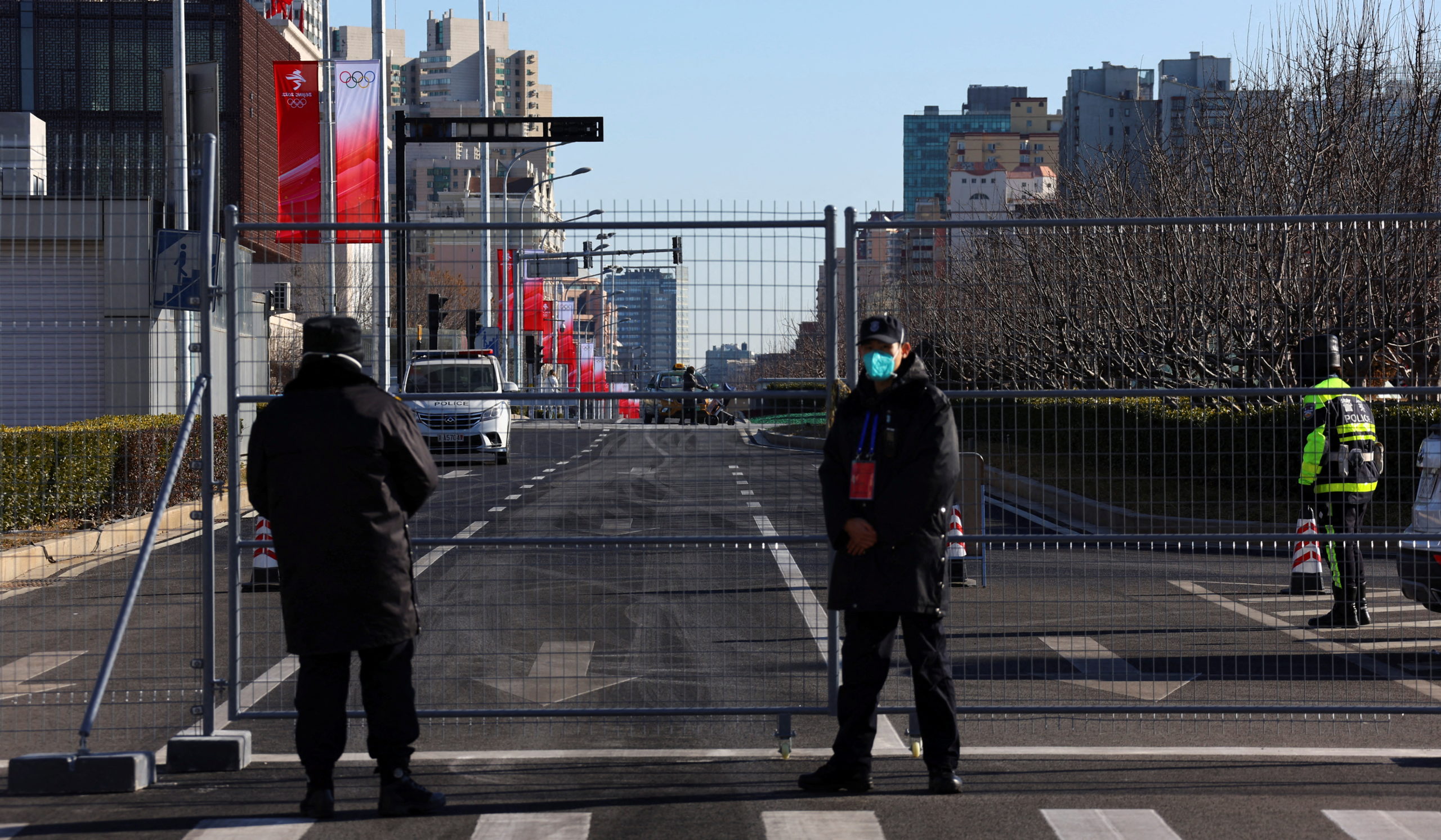 Security staff stand guard inside a closed loop area designed to prevent the spread of the coronavirus disease (COVID-19) ahead of the Beijing 2022 Winter Olympics in Beijing, China January 13, 2022.