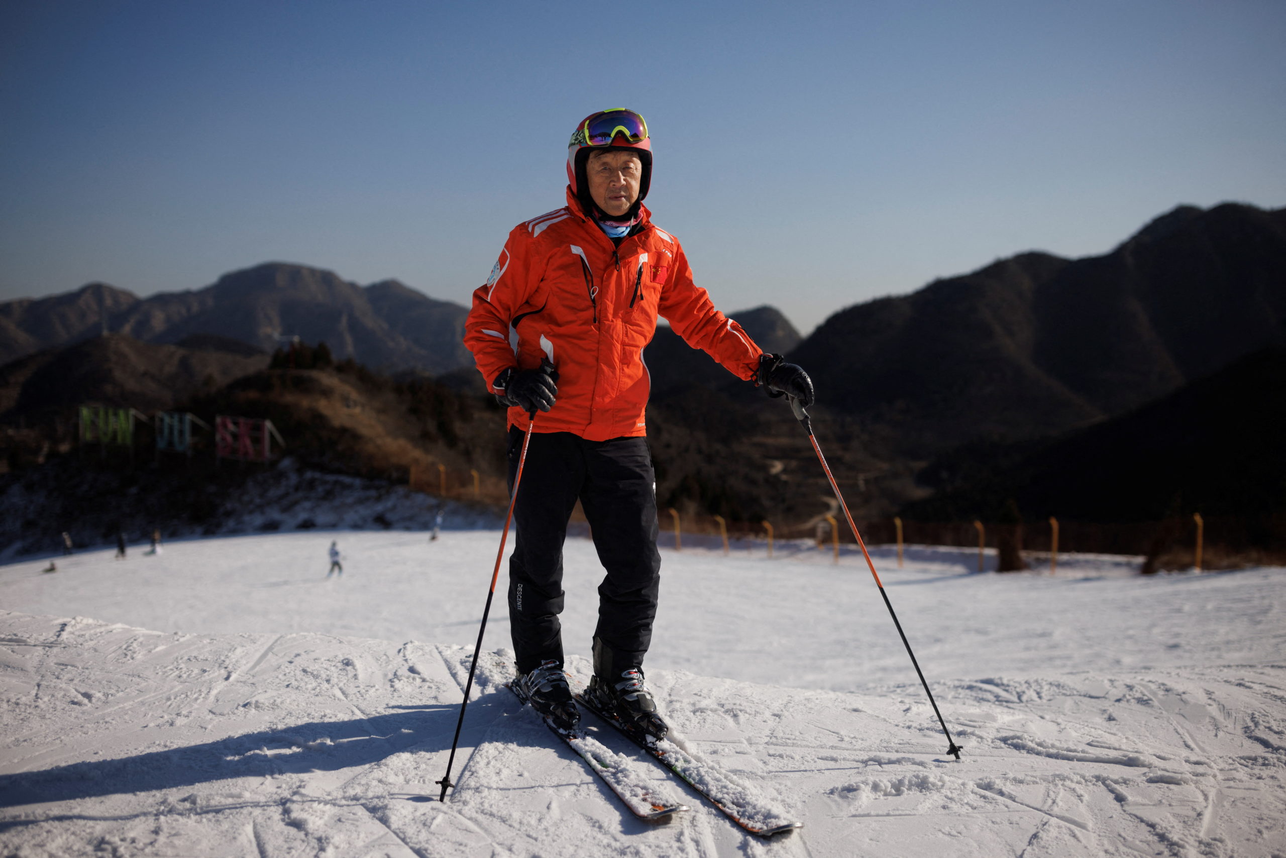 FILE PHOTO: Shan Zhaojian, 84, nicknamed China's "father of skiing", poses for a picture at the Yunju ski resort in Beijing, China, December 29, 2021. Picture taken December 29, 2021 