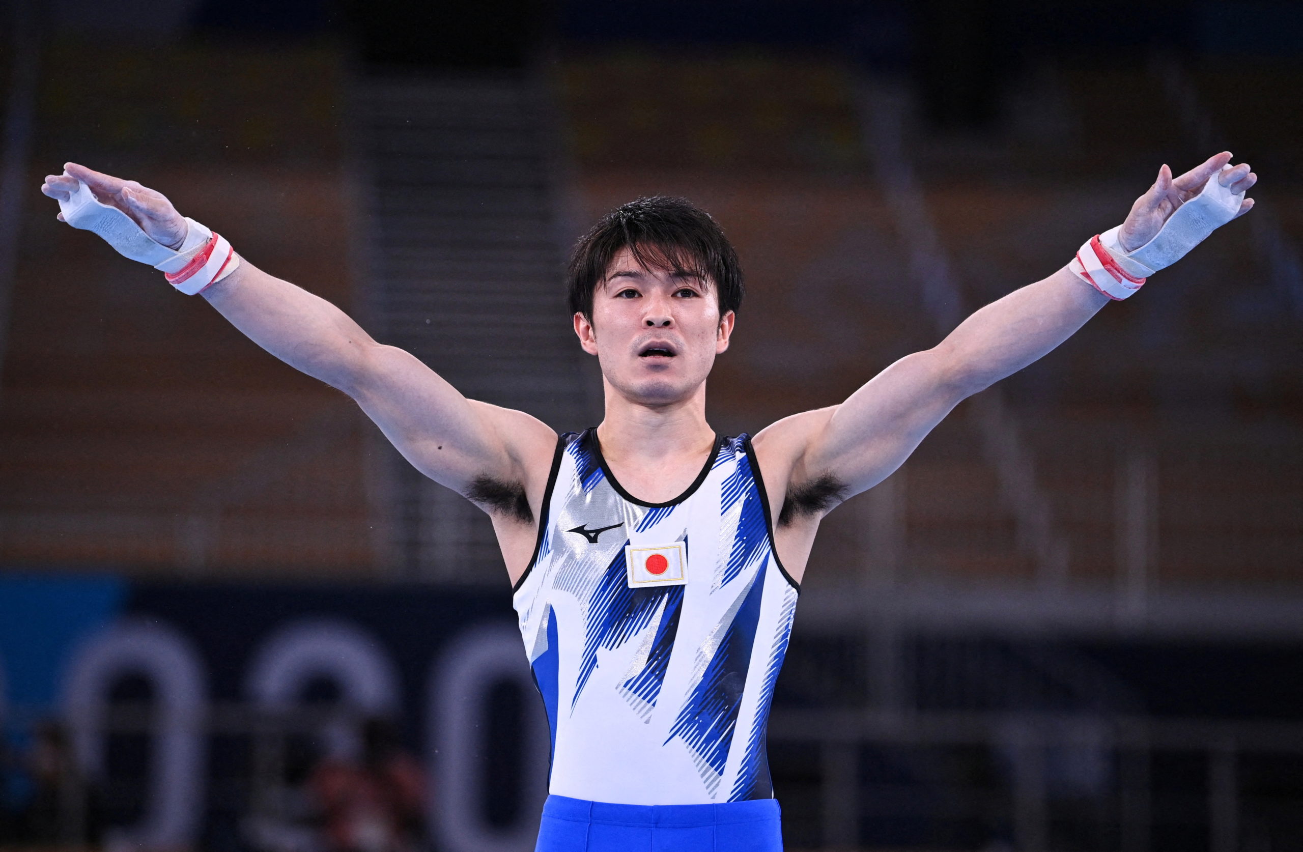 Kohei Uchimura of Japan stands after competing on the horizontal bar.