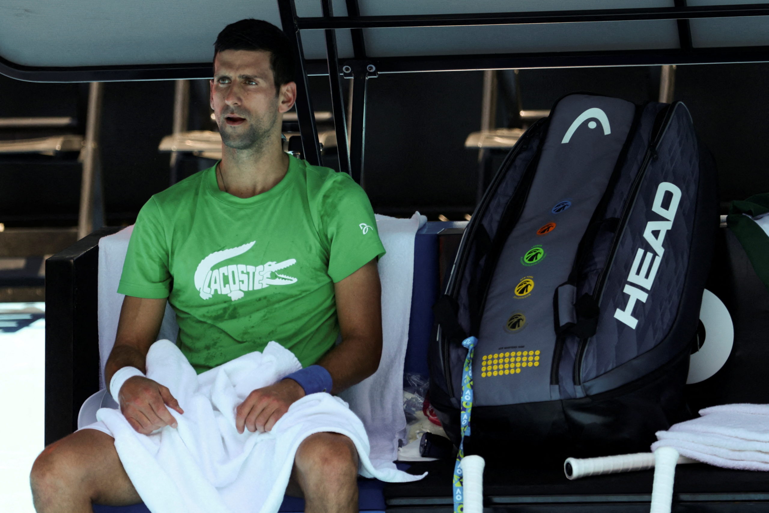 Serbian tennis player Novak Djokovic rests at Melbourne Park as questions remain over the legal battle regarding his visa to play in the Australian Open in Melbourne, Australia, January 13, 2022. 