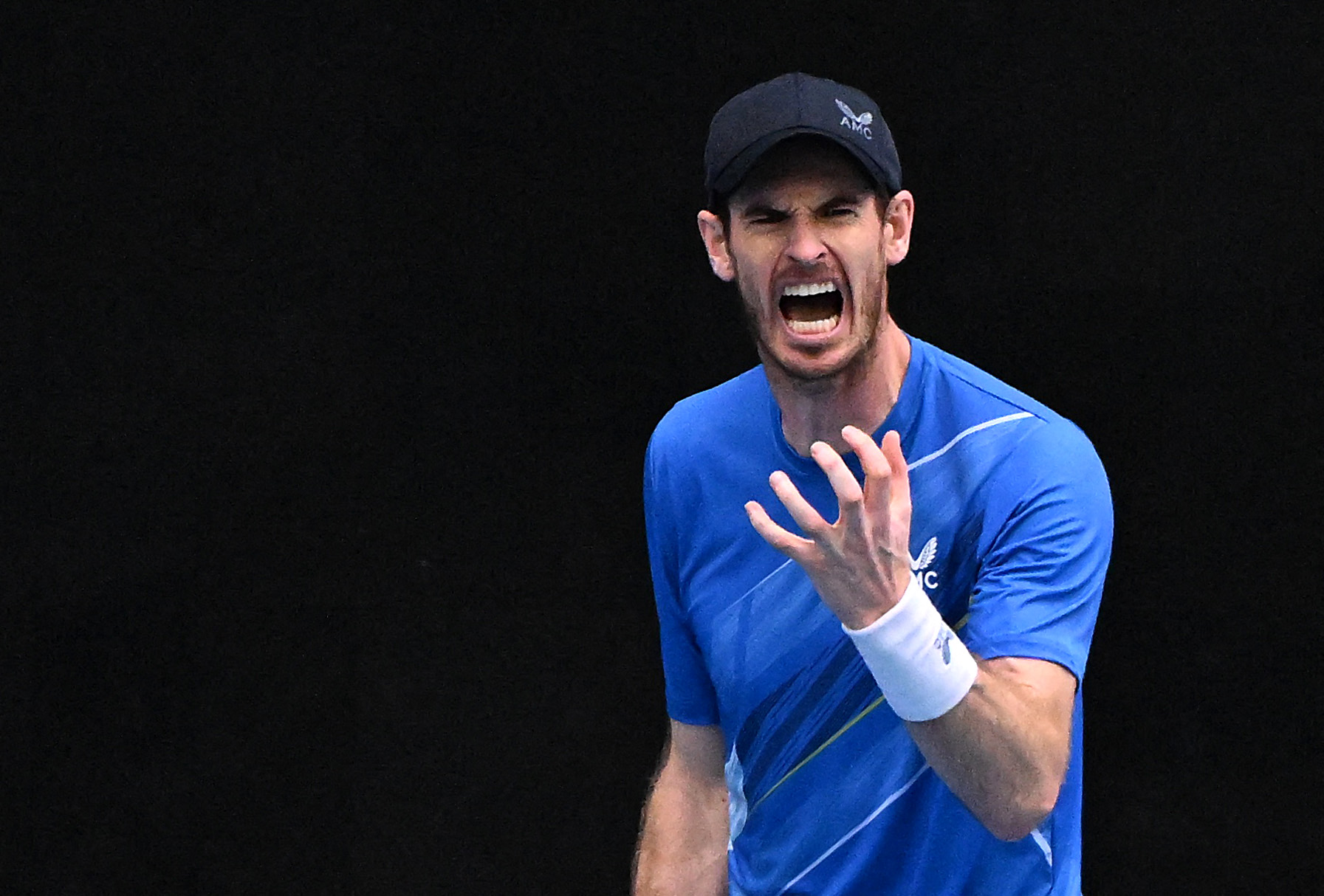 Britain's Andy Murray reacts during his first round match against Georgia's Nikoloz Basilashvili