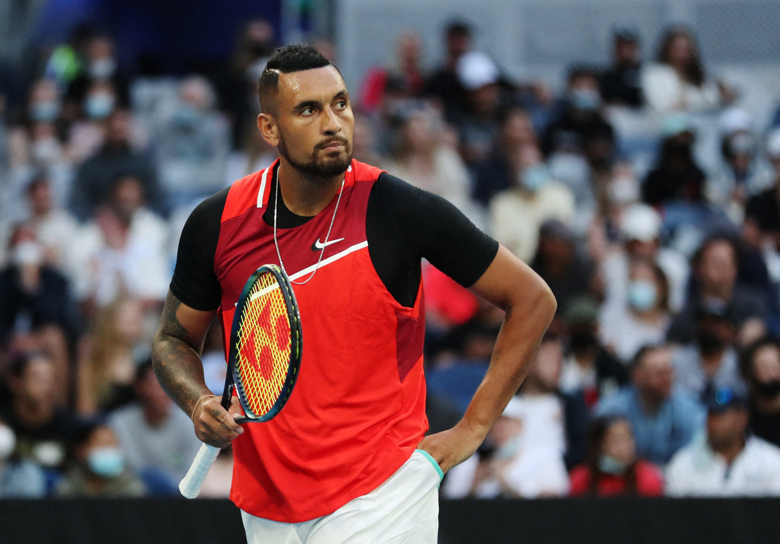 Australia's Nick Kyrgios reacts during his first round match against Britain's Liam Broady in the Australian Open on January 18, 2022. 