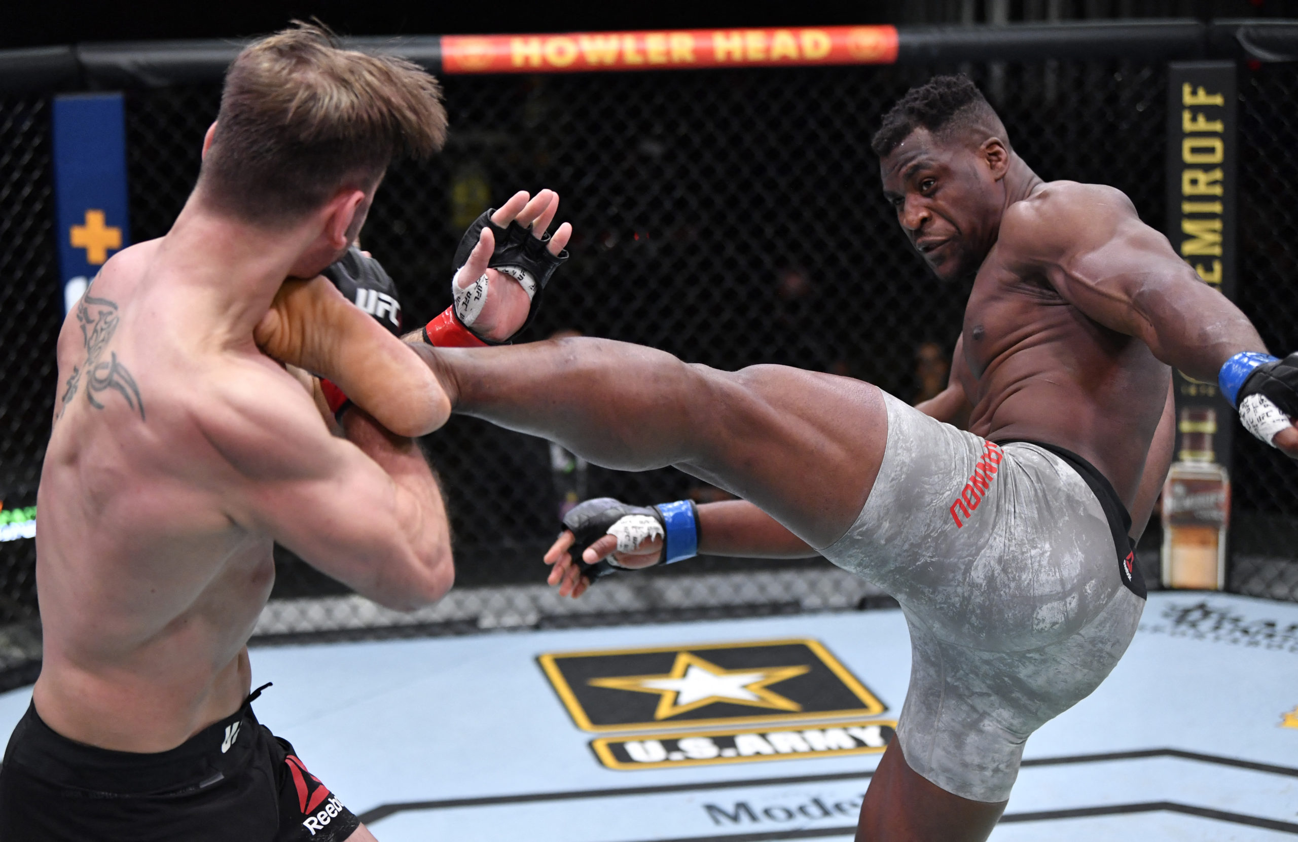 Mar 27, 2021; Las Vegas, NV, USA; Francis Ngannou of Cameroon kicks Stipe Miocic in their UFC heavyweight championship fight during the UFC 260 event at UFC APEX on March 27, 2021 in Las Vegas, Nevada. 