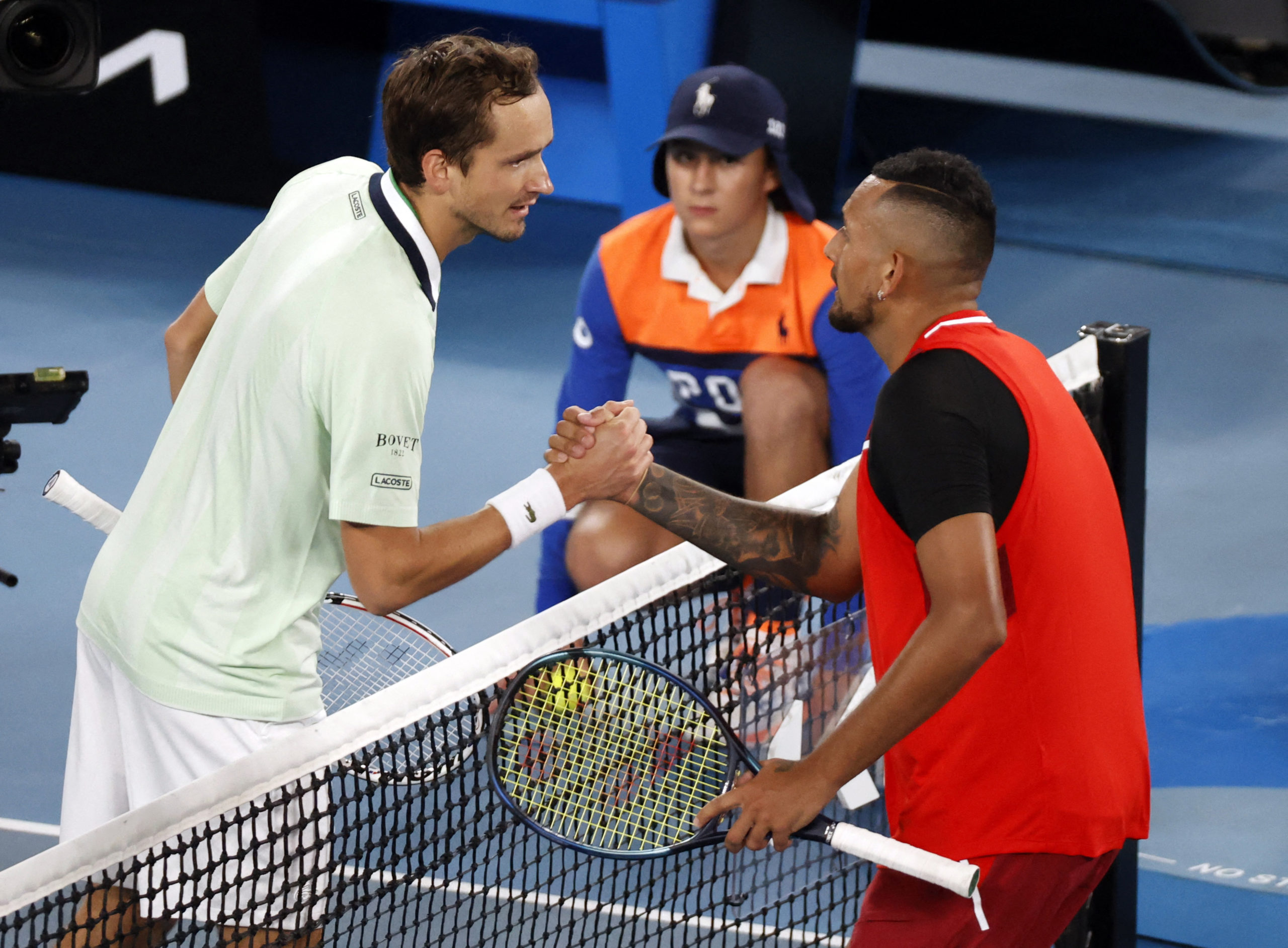 Tennis - Australian Open - Melbourne Park, Melbourne, Australia - January 20, 2022 Russia's Daniil Medvedev and Australia's Nick Kyrgios shake hands after their second round match