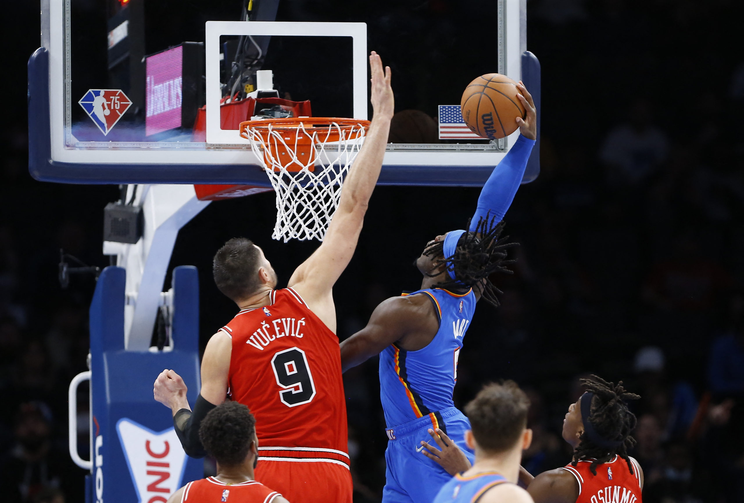 Oklahoma City Thunder forward Luguentz Dort (5) goes to the basket as Chicago Bulls center Nikola Vucevic (9) defends during the second half at Paycom Center. Chicago won 111-110. 