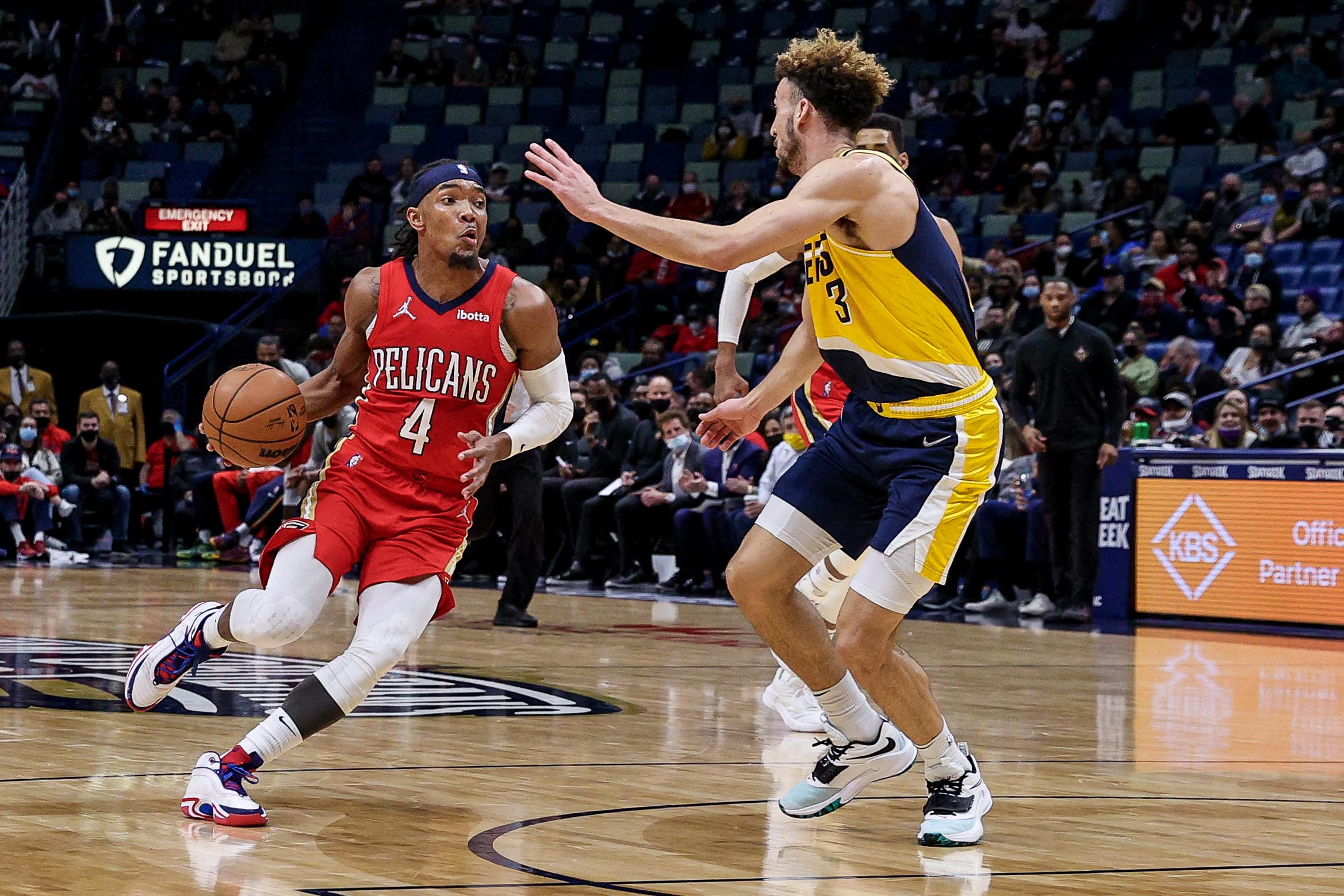 New Orleans Pelicans guard Devonte' Graham (4) dribbles against Indiana Pacers guard Chris Duarte (3) during the second half at the Smoothie King Center. 