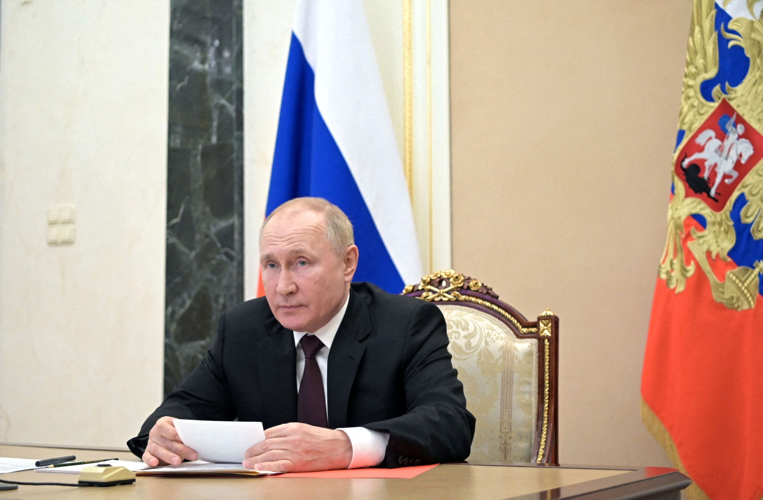 FILE PHOTO: Russian President Vladimir Putin chairs a meeting with members of the Security Council via a video link in Moscow, Russia January 21, 2022. 
